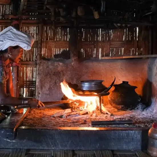 Mro tribal lady is preparing a traditional food at her home kitchen in Chittagong hill tracts