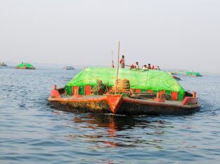 sand carrying boat looks like a submarine on meghna river near sonargaon