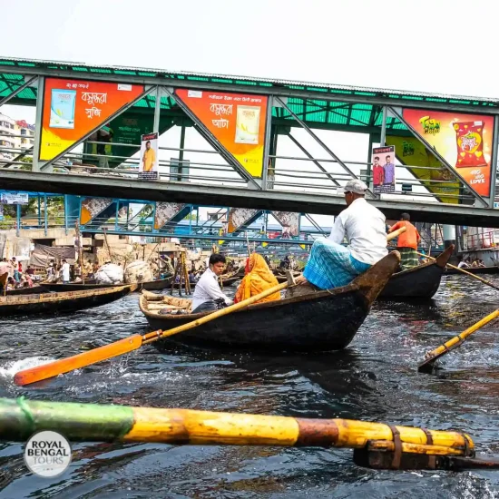 Experience the vibrant life of Buriganga River on a Country Boat Ride during your Half Day Trip to Old Dhaka