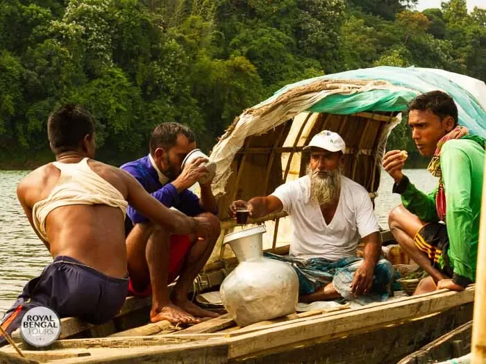 Tourists experience a floating restaurant on the river, a local workplace during a village homestay
