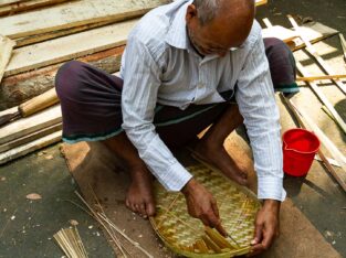 Village artisan at his bamboo craftsmanship in Bangladesh