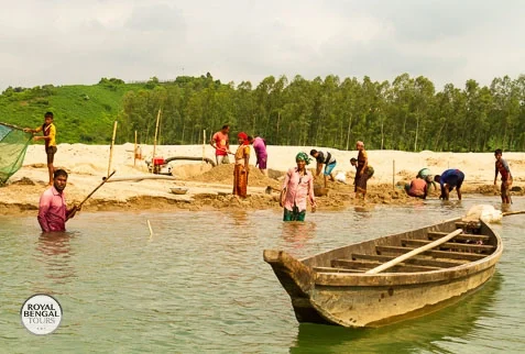 Photo of a person fishing in a river during a homestay in Bangladesh