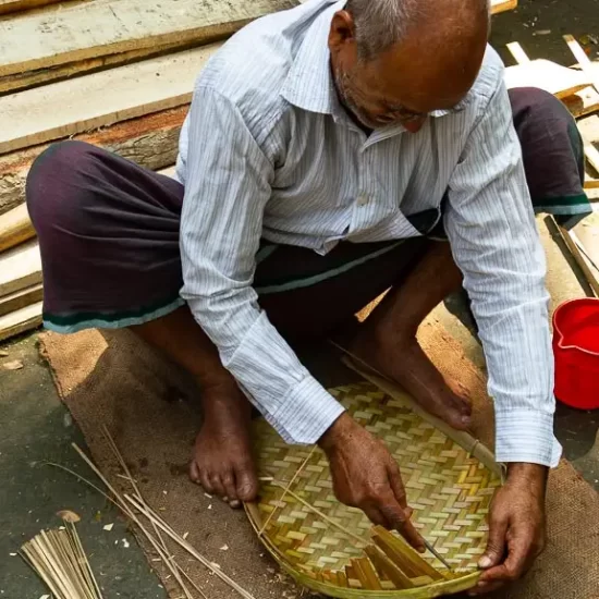 Village artisan at his bamboo craftsmanship in Bangladesh