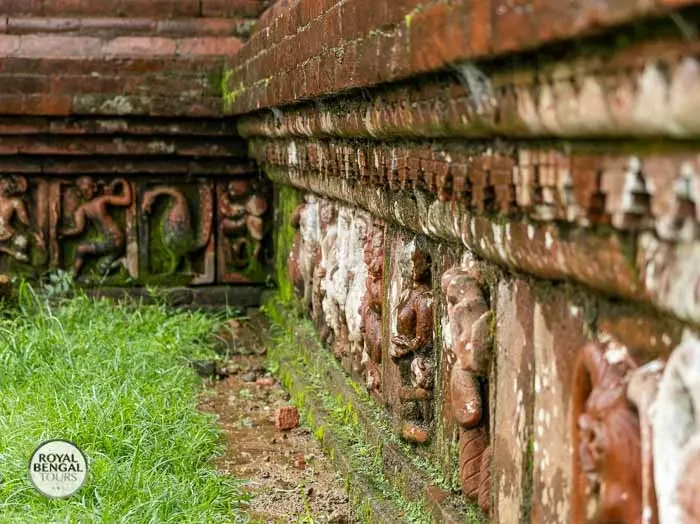Terracotta panels on the lower wall of Somapura Mahavihara Buddhist monastery