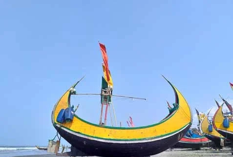 Traditional Fishing Vessel on Scenic Beach