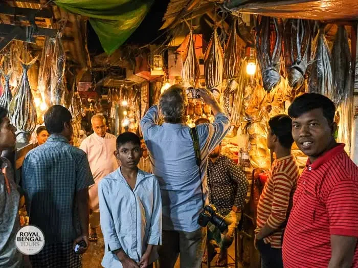 Cox's Bazar evening fish market with vendors selling fresh seafood