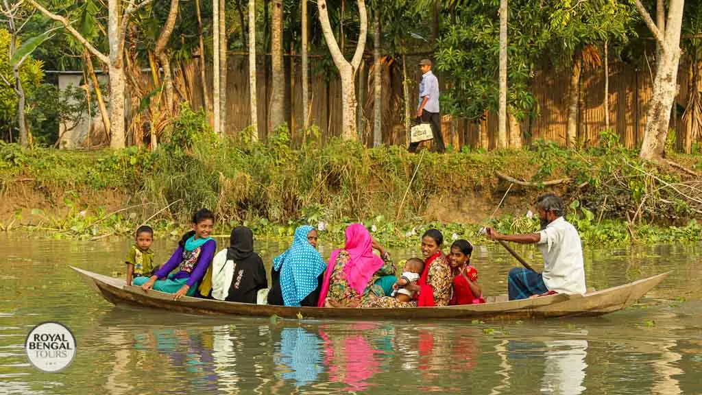 Family traveling by boat on their way to visit relatives in Barisal