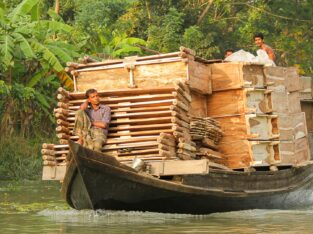 i boat is carrying huge numbers of wooden Furnitures in the south of Bangladesh
