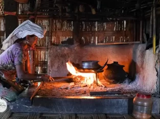 Mro tribal lady is preparing a traditional food at her home kitchen in Chittagong hill tracts