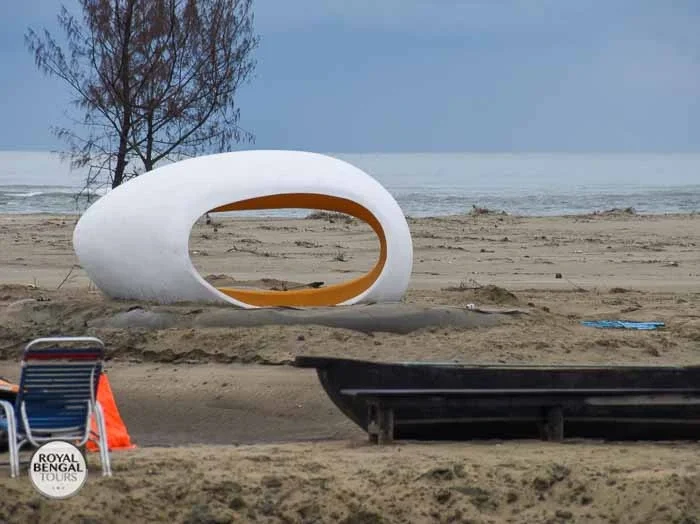 Cox's Bazar resort beachfront chill out area with lounge chairs and umbrellas