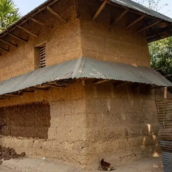 Two story traditional mud house in Bangladesh