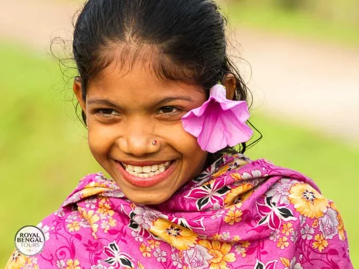 A radiant smile amidst the beauty of Nijhum Dwip