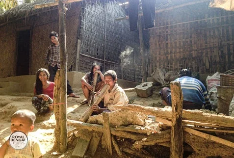 Chakma tribal man enjoy his bamboo hookah pipe in Rangamati