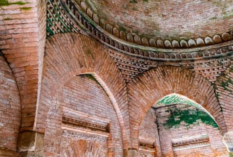 fascinating decoration on the curved brick pillars and dome inside of goaldi mosque