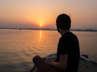 enjoying the sunset from a boat on meghna river near sonargaon