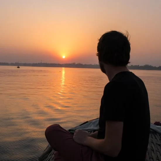 enjoying the sunset from a boat on meghna river near sonargaon