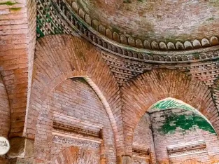 perfect roundesh dome of goaldi mosque stands on brick pillars