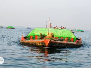 sand carrying boat looks like a submarine on meghna river in Bangladesh