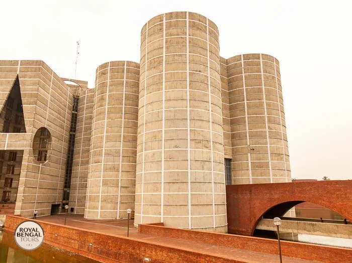 National Parliament building featuring distinctive cylindrical towers and red brick walkway