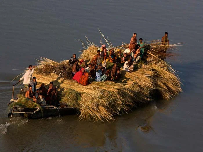 Local people carrying goods by boat, depicting daily life on a Char island