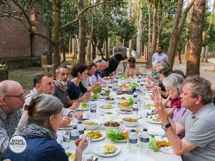Group of architects enjoying a meal at site in bangladesh
