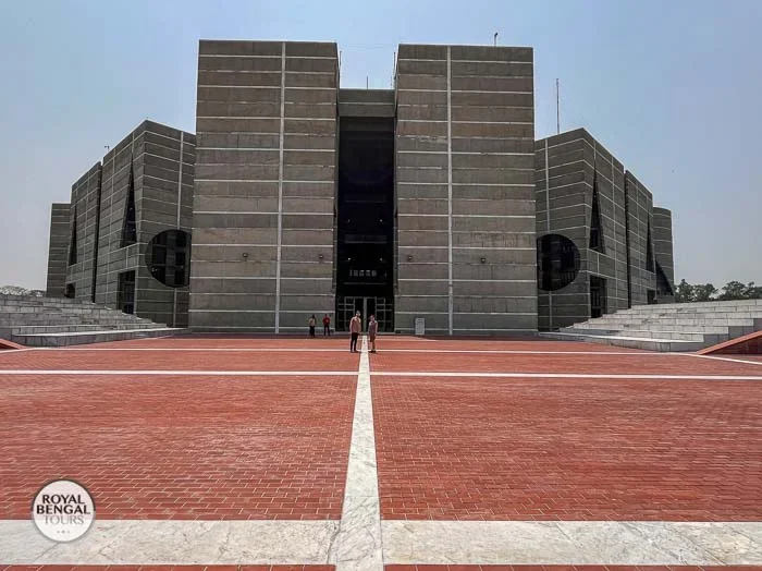 Front view of Bangladesh Parliament House, featuring its concrete facade and expansive plaza