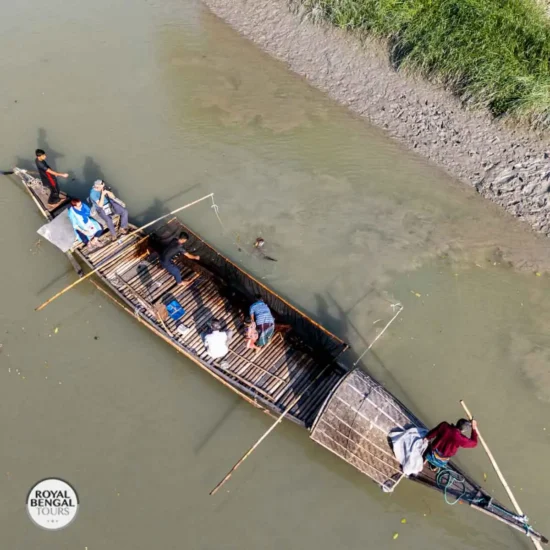 Fishermen and otters working together on a traditional wooden boat
